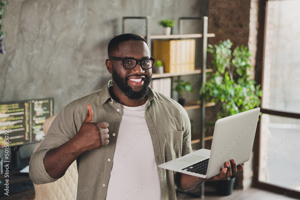 Aufkleber photo of successful guy designer developer hold laptop make thumb up symbol suggest service support 