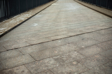 Road is made of tiles. Pedestrian area.