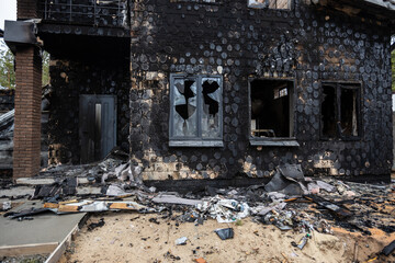 Hostomel, Kyev region Ukraine - 09.04.2022: Cities of Ukraine after the Russian occupation. Houses that burned down after being hit by rockets, mines. Irpin, Bucha, Gostomel.