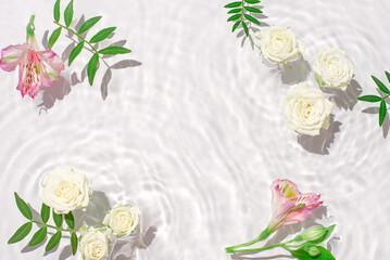 Sunny summer cosmetic background with flowers.