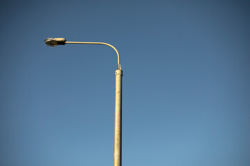 Street lamp. Lamp against sky. Urban infrastructure.