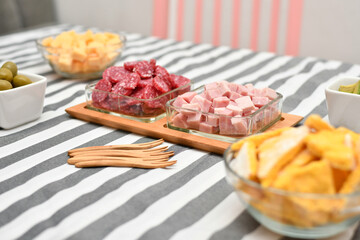 Selective focus of a picada with cold cuts and copy space.