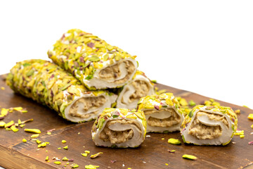 Turkish Delight with Pistachio. Turkish delight with cream filling, isolated on a white background. Traditional Turkish cuisine delicacies. close up
