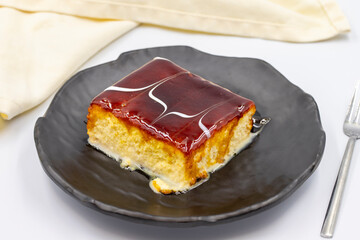 Trilece dessert with caramel on a white background. World cuisine desserts. close up