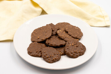 Chocolate with Hazelnut Chips. Special chocolates on a white background. close up