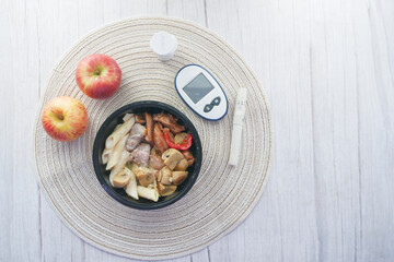 diabetic measurement tools and healthy food on table 
