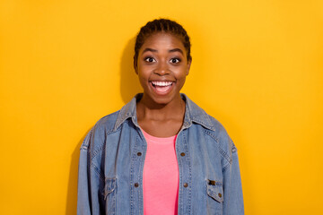 Photo of young lovely girl astonished glad unexpected information discount isolated over yellow...