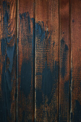 Close-up view of weathered old wooden door in brown and black.