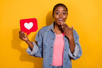 Photo of young excited lady share comment advertise laughter wow unexpected isolated over yellow...