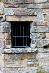 Fototapeta na wymiar Barred Window Opening in a Medieval Building in Stirling Scotland