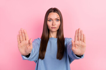 Portrait of attractive content girl showing palms stop violation human rights decision isolated...