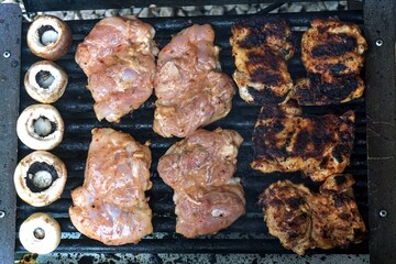 Chicken and mushrooms cooked on the barbecue.
