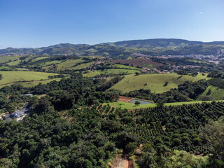 Fototapeta na wymiar fields with plantations in small mountains in a city in the interior - Socorro, São Paulo, Brazil