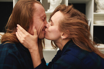 Naklejka premium Happy and funny couple kissing. Image ready for International, World Kissing Day 6 July or Valentine's Day, with copy space for any text or design.