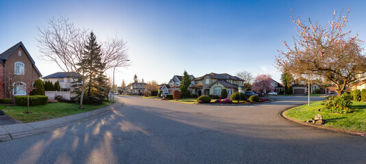 Residential neighborhood Street in Modern City Suburbs. Sunny Spring Morning Sunrise. Fraser...