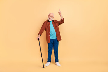 Full size photo of good mood friendly grandfather recommend promote advert isolated on beige color background