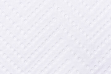 Background texture of paper towel with circles and lines close up. Macro shot of textured paper for wiping and napkins. Detail white paper structure of kitchen roll.