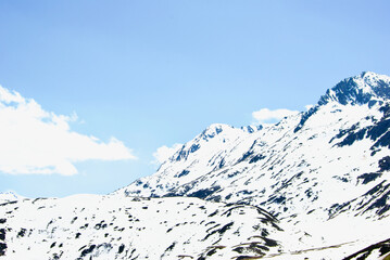 Fototapeta na wymiar Mountainous landscape in Switzerland with snowy peaks in summer.