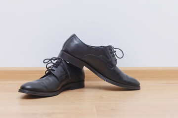 Men groom black shoes 