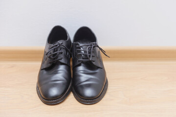 Men groom black shoes 