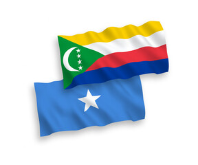 National vector fabric wave flags of Union of the Comoros and Somalia isolated on white background. 1 to 2 proportion.