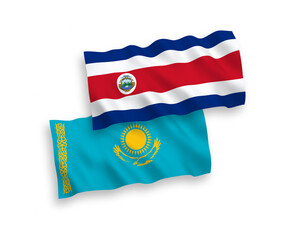 National vector fabric wave flags of Kazakhstan and Republic of Costa Rica isolated on white background. 1 to 2 proportion.