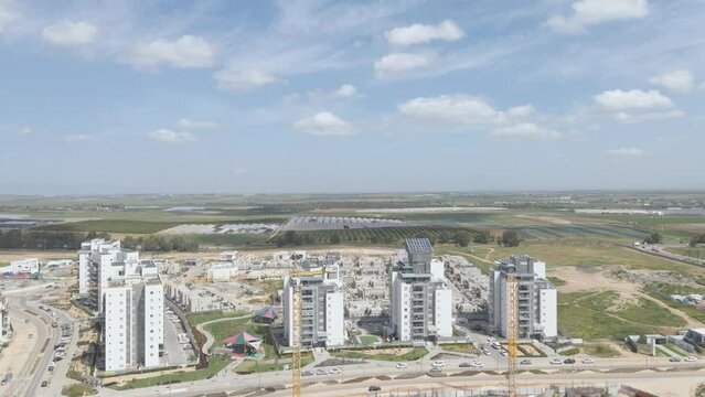 new neighborhood buildings with cranes at southern district city netivot