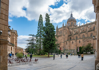 Salamanca, Spain - november 6 2022 - tourists and locals visiting the aquare in front of the Catedral de Salamanca