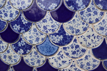 blue and white flowers type tiles close-up background and texture
