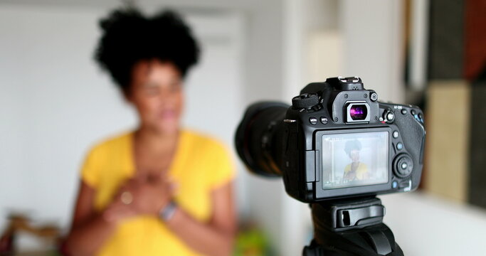 Female vlogger recording broadcast at home