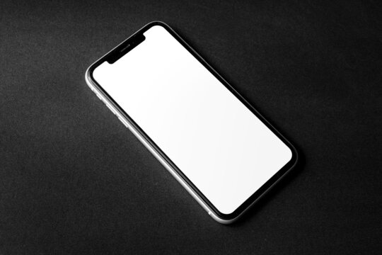Single smartphone screen mockup above flat paper texture