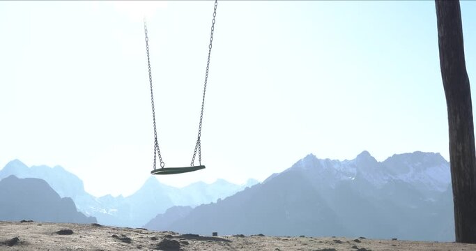swing moving in the wind in mountain area in Ria&ntilde;o, Leon Spain, without people