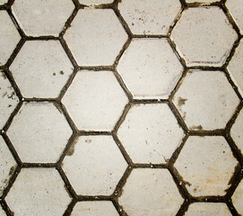 Top view of the hexagonal gray street tile background texture.