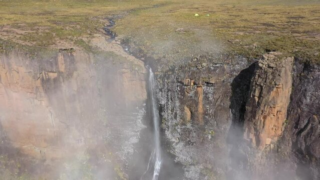 Stunning aerial view of famous Tugela falls at Drakensberg mountains. Drone flying from cliff to cloud