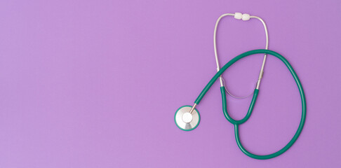 Medical stethoscope on color background with place for text. Abstract medical background