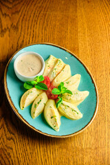 Dumplings di patate with basil and tomato sauce