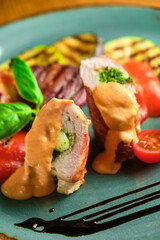 Fried pork rolls stuffed with prunes, wrapped in bacon,