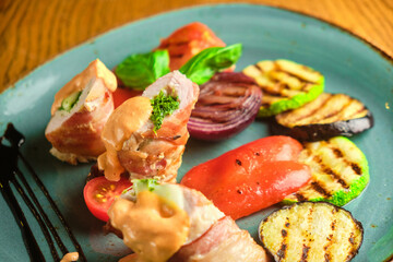 Fried pork rolls stuffed with prunes, wrapped in bacon,