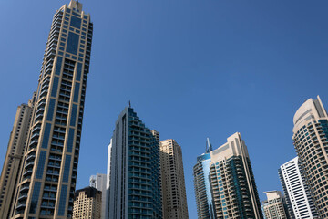 Fototapeta na wymiar Futuristic skyscrapers against the blue sky, Dubai, UAE
