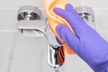 Cleaning tap with dry polishing rag.