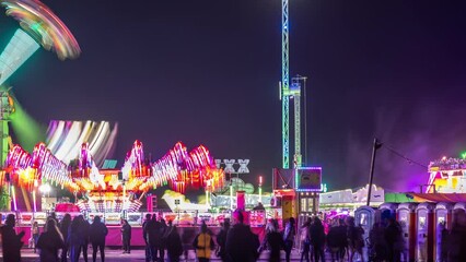 a funfair with rides at night