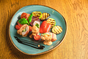 Fried pork rolls stuffed with prunes, wrapped in bacon,