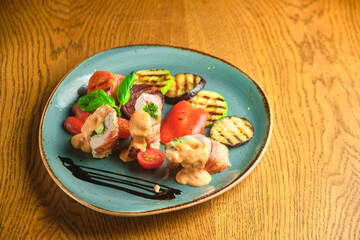Fried pork rolls stuffed with prunes, wrapped in bacon,