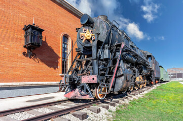 Soviet retro steam locomotive at the railway station