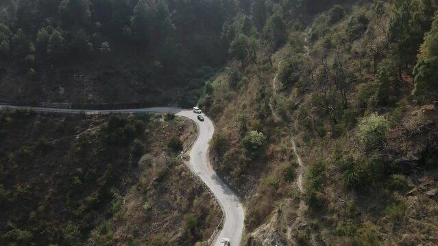 car driving in narrowed road in india Himachal Pradesh Himalaya mountains remote forest natural aerial landscape