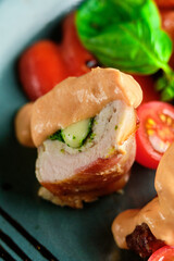 Fried pork rolls stuffed with prunes, wrapped in bacon,