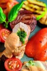 Fried pork rolls stuffed with prunes, wrapped in bacon,