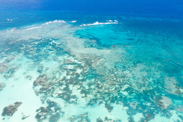 Caribbean sea with reef and turquoise water, tropical destinations. Aerial view