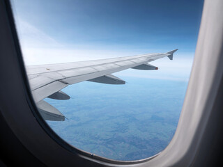 Fototapeta na wymiar Airplane wing. View from plane window. Travel and transport concept