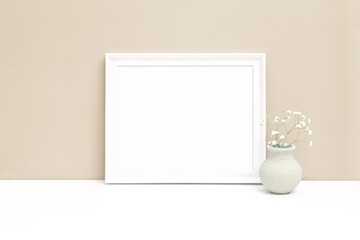 Fototapeta na wymiar White horizontal wooden frame mockup with small vase and white flower